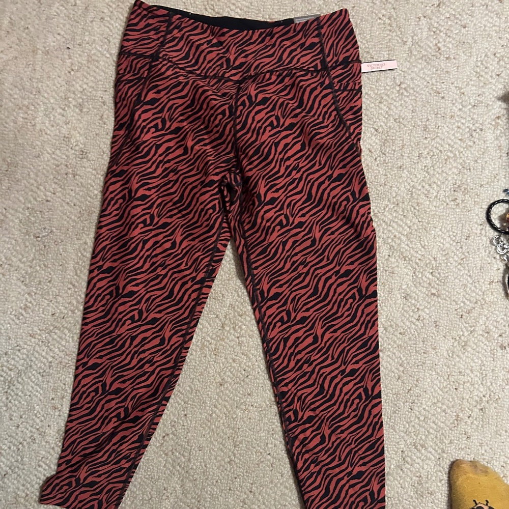 NWT large 7/8 Victoria’s Secret Zebra print orange and black leggings